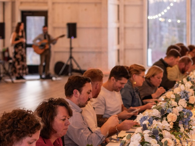 Gus & Jean performing in the background of an event in New England.